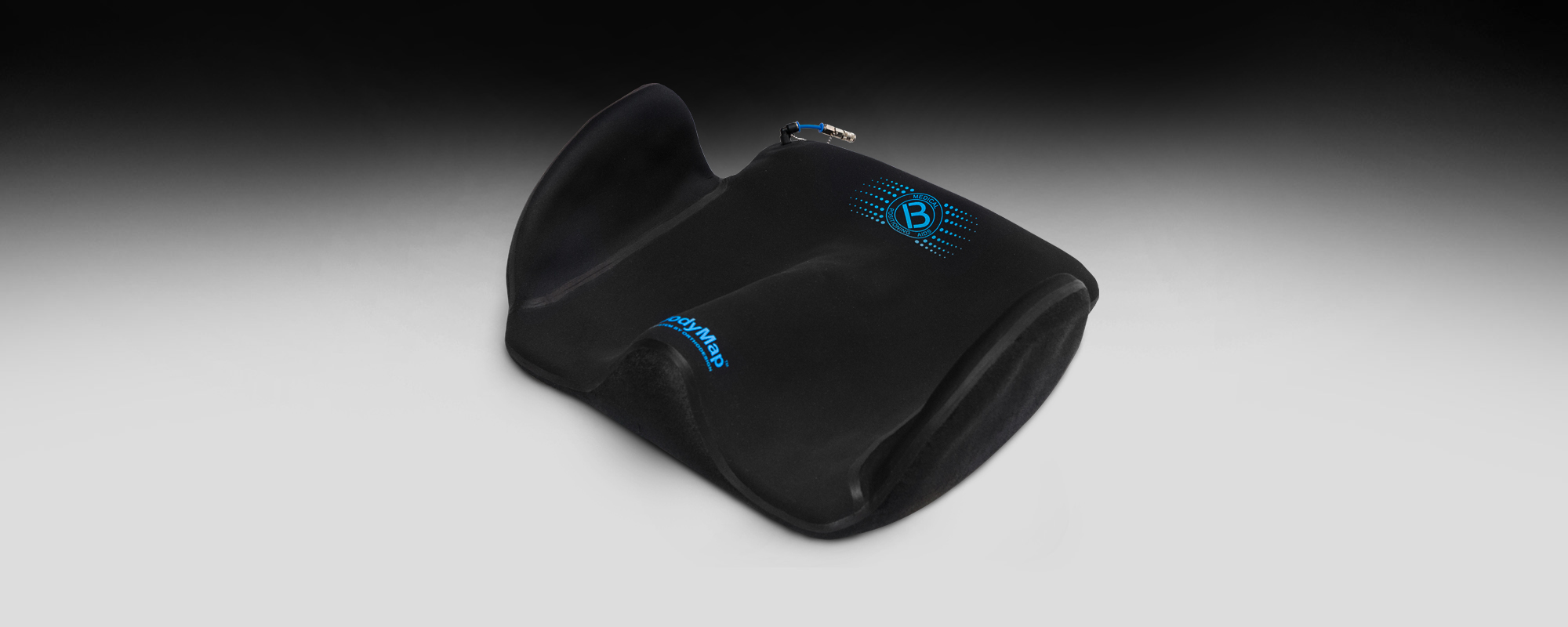 Sitting positioning cushion with thigh abduction wedge and lateral supports BodyMap® A+